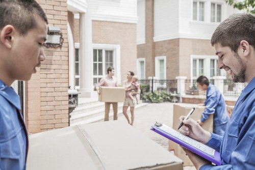 Movers working carefully in a Belgravia street with period townhouses