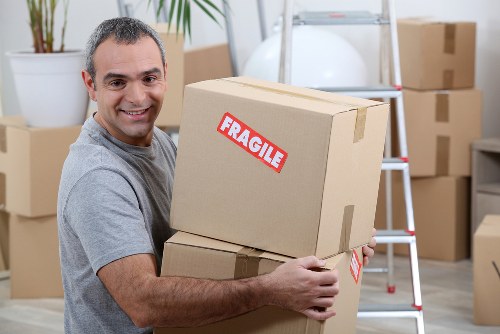 Man with van service loading boxes in Belgravia street