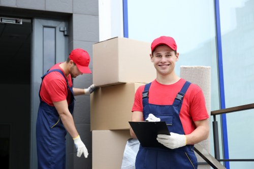 Moving team preparing belongings safely with protective materials