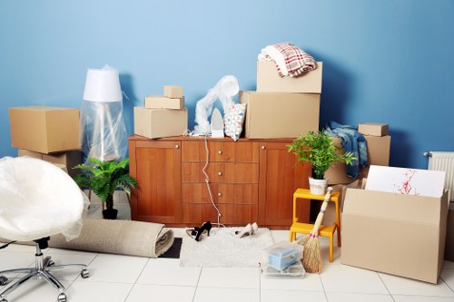 Office movers handling equipment in a central London building