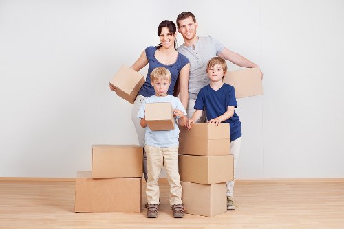 Moving team handling furniture during a Belgravia relocation