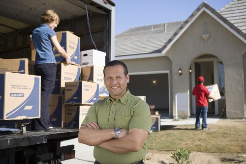 Professional movers handling furniture in Belgravia