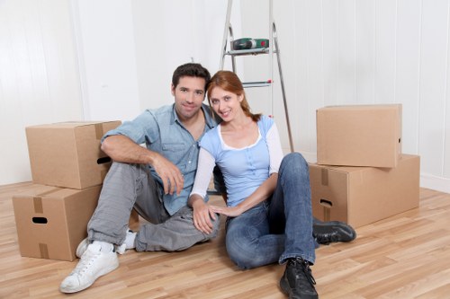 Professional movers carrying furniture safely